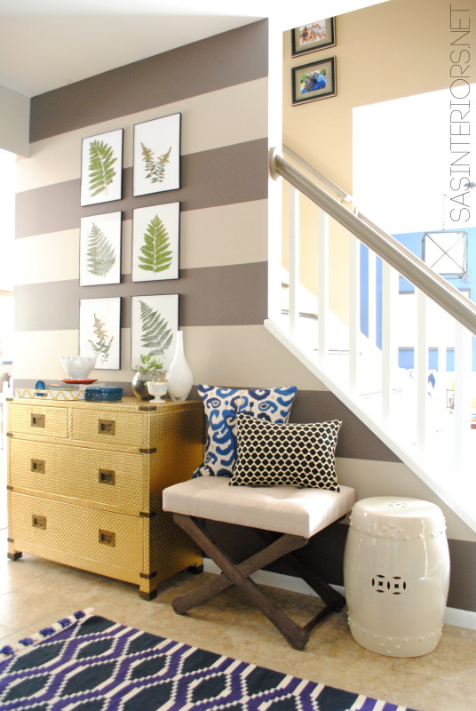 Foyer Remodel with newly striped walls, fern art, and layers of colors + texture.  Spaced designed by @Jenna_Burger, www.sasinteriors.net