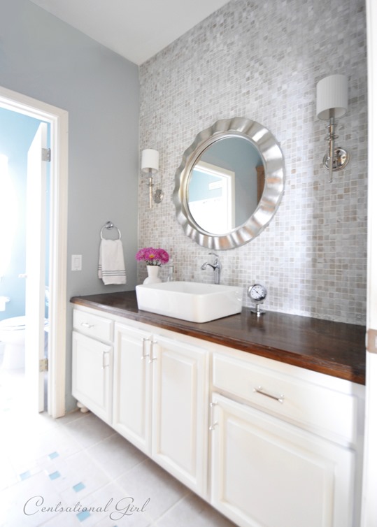 5 Ways to Upgrade a Bathroom on a Budget: 'After' picture of a newly painted cabinet
