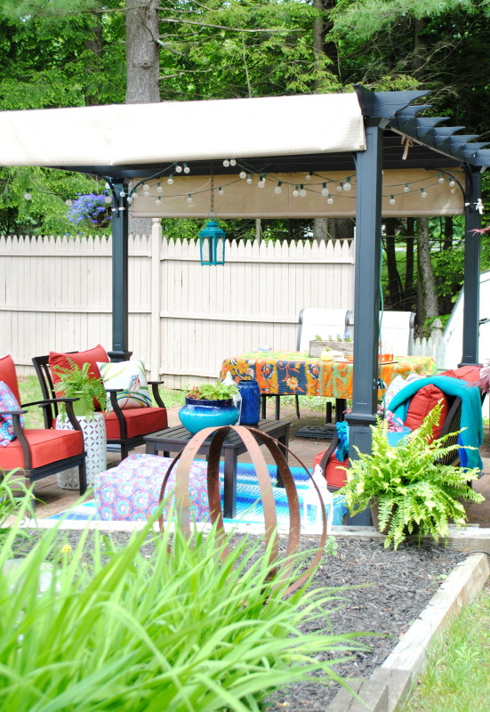 A revamped patio with new outdoor furniture + a Pergola. This new space is surrounded by flowers & the sounds of water from a small pond. A tranquil & ideal oasis for the Summer!