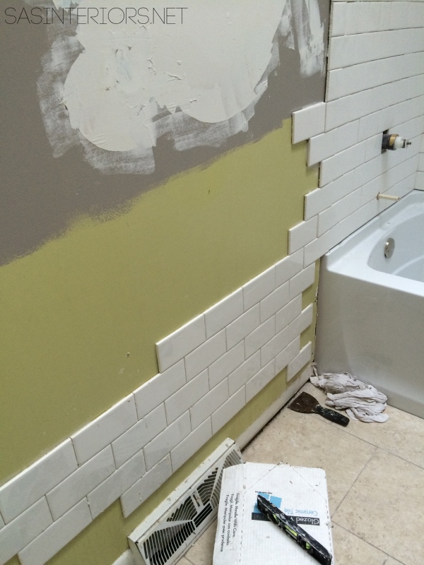 How-To Tile and Grout a Bathroom tub area: tips & tricks to do it yourself. Follow along on this DIY bathroom remodel!