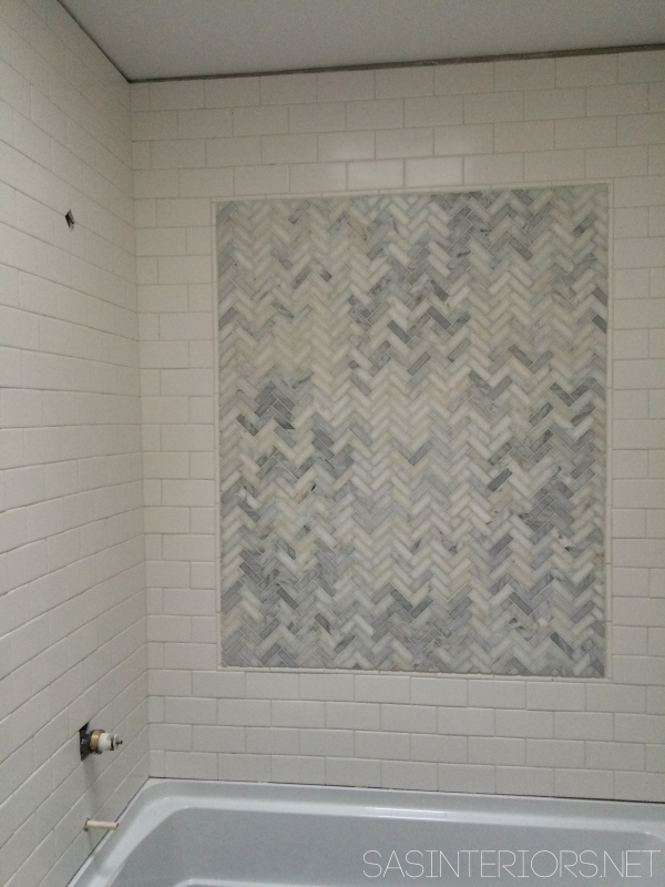 How-To Tile and Grout a Bathroom tub area: tips & tricks to do it yourself. Follow along on this DIY bathroom remodel!