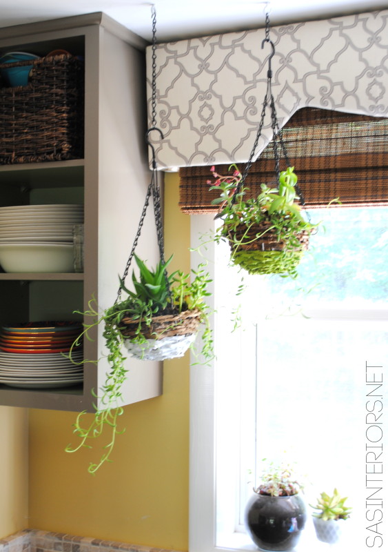 Pre-made succulent hanging basket from Lowe's jazzed up with paint to create a unique Color Block Succulent Basket {EASY DIY}