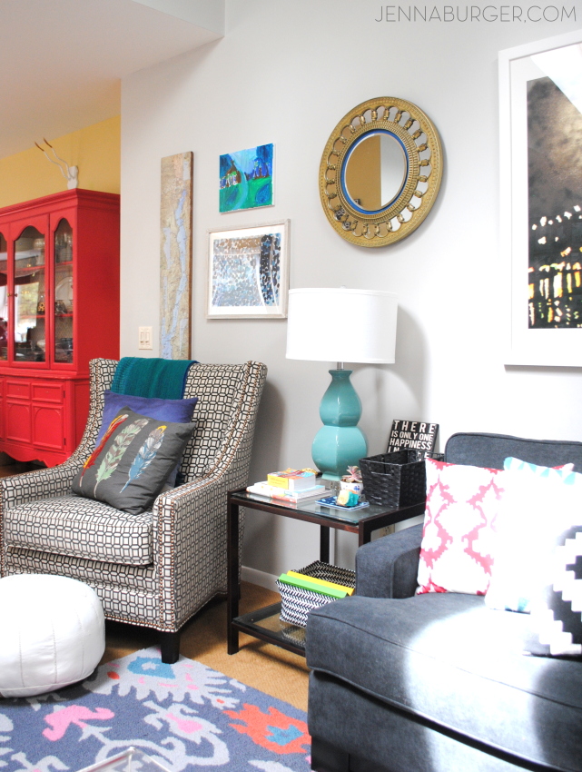 Living Room Makeover with bold black + pops of color [emerald, raspberry, coral, and light blue] Design by Jenna Burger Design, www.jennaburger.com