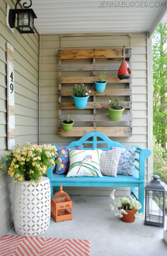 Spring + Summer Front Porch: A small space filled with lots of colors and layers that create a welcoming entry. See the rest of this porch + how it's evolved over the years! www.jennaburger.com