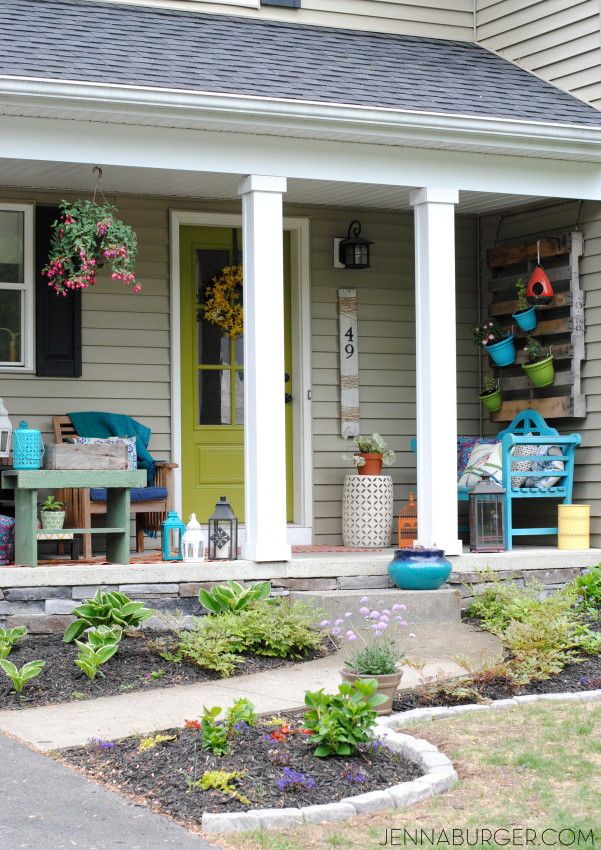 Spring + Summer Front Porch: A small space filled with lots of colors and layers that create a welcoming entry.  See the rest of this porch + how it's evolved over the years! www.jennaburger.com