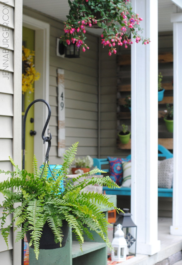 Spring + Summer Front Porch: A small space filled with lots of colors and layers that create a welcoming entry.  See the rest of this porch + how it's evolved over the years! www.jennaburger.com
