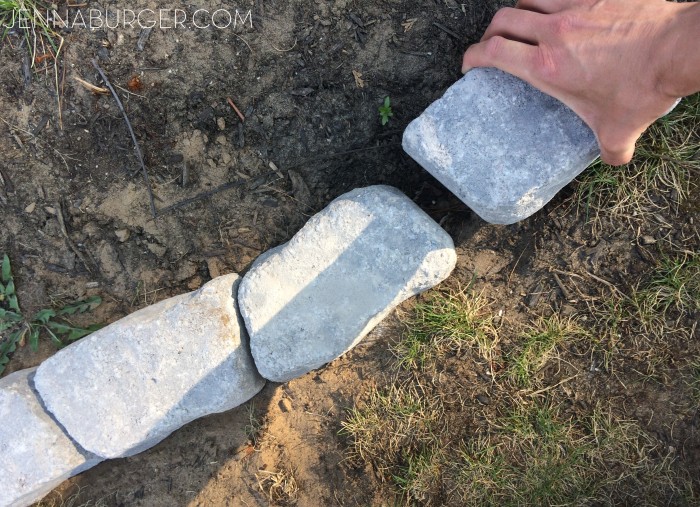 The Perfect Border for your Beds: Defining a gardens edge with inexpensive stone that fit any shape or size garden bed.  Details @ www.jennaburger.com