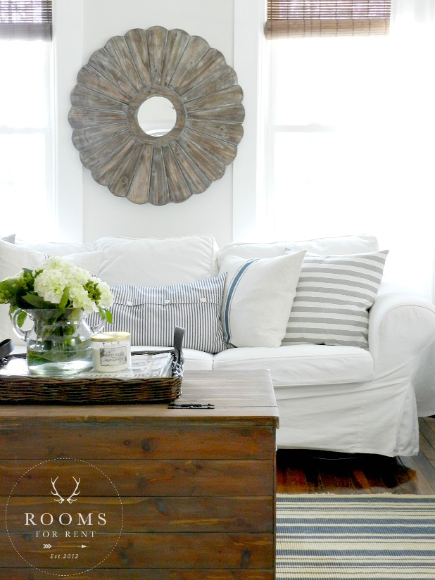 Relaxed with farmhouse flair!  The beautiful living room designed by Bre of Rooms for Rent