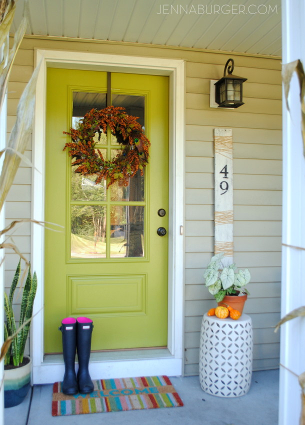 Fall Front Porch using lots of COLOR + seasonal favorites including pumpkins, gourds, cornstalks, and mums! Full tour of this Fall Front Porch @ www.JennaBurger.com